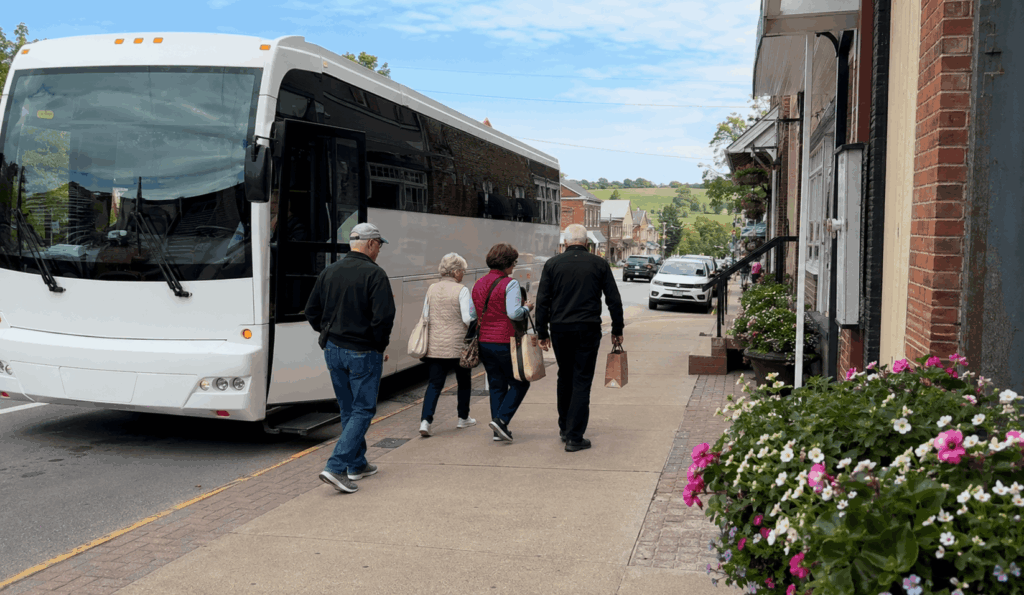 charter bus group arriving in ohio amish country near berlin from columbus