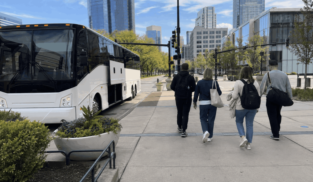 charter bus arriving in downtown indianapolis with a group from columbus near major event venues